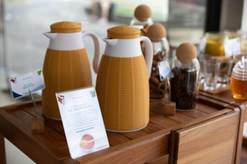 a group of wicker bottles sitting on a table at Transamerica Executive Belo Horizonte in Belo Horizonte
