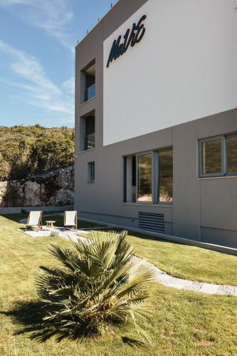 a building with a sign on the side of it at Boutique hotel MaViE - Adults Only in Neum