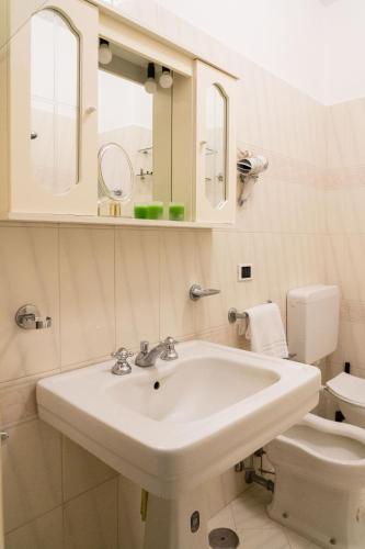 a bathroom with a sink and a toilet at Dimora Bruno e Rubina (centrale a Capri) in Capri