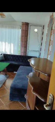 a living room with a table and a pool table at Beyaz hostel in Trabzon
