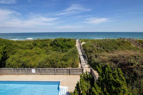 a swimming pool with a view of the ocean at OCEANFRONT, Private Pool, Rec Rm, Ocean Views! PI265, Mroning Star in Sanderling