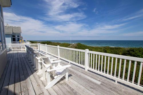 a wooden deck with a bench on the beach at OCEANFRONT, Private Pool, Rec Rm, Ocean Views! PI265, Mroning Star in Sanderling