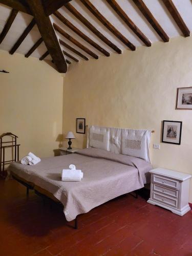 Ένα ή περισσότερα κρεβάτια σε δωμάτιο στο Agriturismo Poggiolo
