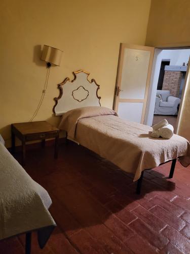 Ένα ή περισσότερα κρεβάτια σε δωμάτιο στο Agriturismo Poggiolo
