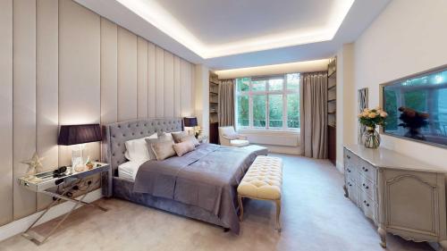 a bedroom with a large bed and a window at The Harrington - Knightsbridge - 18 Rutland Gate in London