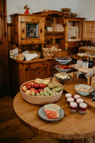 a table with a bunch of food on it at Bio-Pension Bliem in Altenmarkt im Pongau