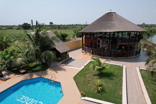 an aerial view of a resort with a swimming pool at Royal Riverside Lodge in Big Ada