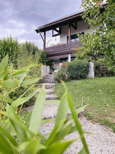 a house with stairs in front of a house at Ferienwohnung „Reuth“ in Weißenbrunn