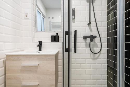 a bathroom with a shower and a sink at ALCALA QUINTANA - 3 Bedrooms in Madrid