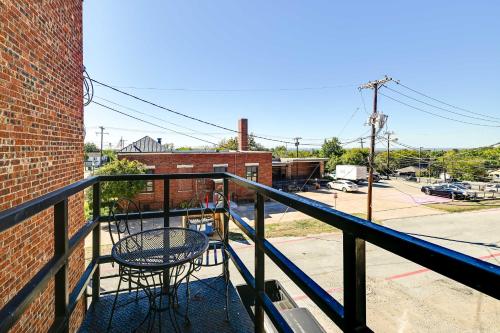 a balcony with two chairs and a table on it at Western-Themed Decatur Studio on Main Street! in Decatur
