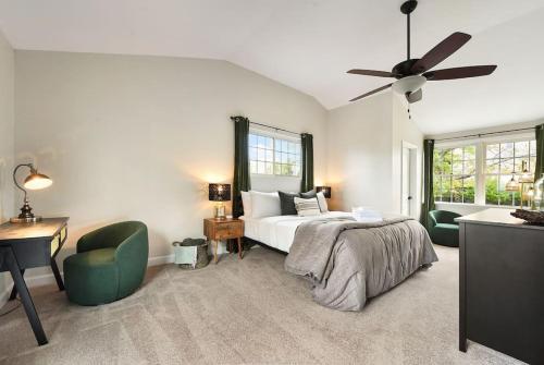 a bedroom with a bed and a ceiling fan at The Cielo - Ohio River Views in the City in Pittsburgh