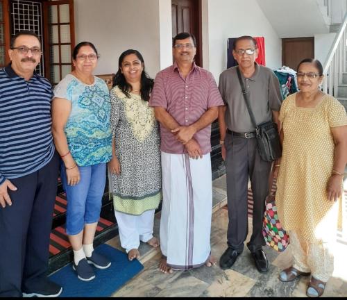 a group of people posing for a picture at Urban Rose Homestay in Kannur