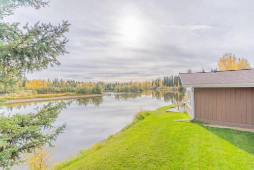 a house with a view of a river at The Chena River House River Suite in Fairbanks