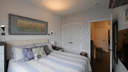 En eller flere senge i et værelse på Le 204 Champlain Bromont