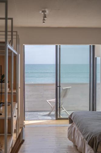 Ένα ή περισσότερα κρεβάτια σε δωμάτιο στο Hotel Mar Blanco