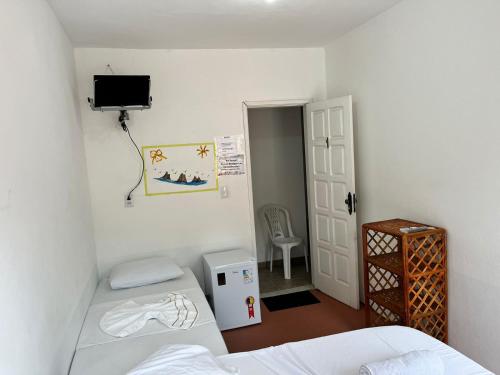 Katil atau katil-katil dalam bilik di Tia Preta Pousada