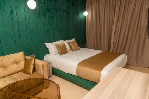 Кровать или кровати в номере Residence La Perle de l'Atlas Marrakech