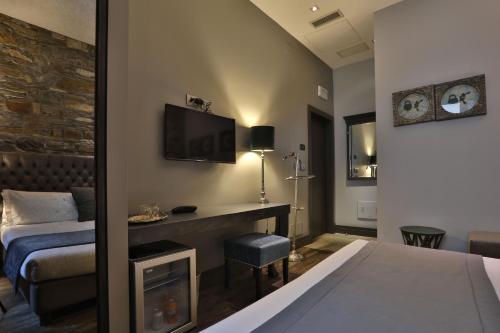 Postel nebo postele na pokoji v ubytování Forvm boutique Hotel