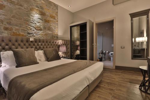 Postel nebo postele na pokoji v ubytování Forvm boutique Hotel
