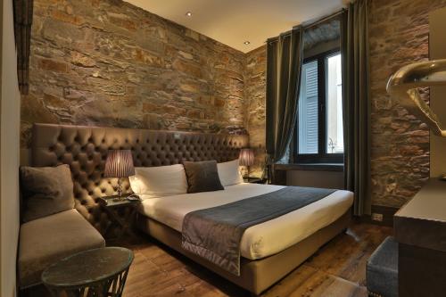 Postel nebo postele na pokoji v ubytování Forvm boutique Hotel