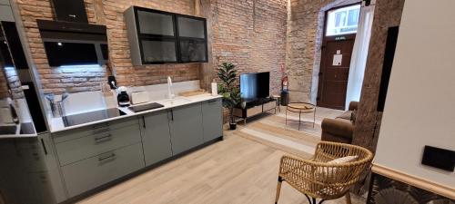 Kuchyň nebo kuchyňský kout v ubytování SUITE HAUS BAHIA