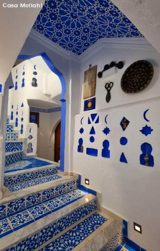 a blue and white staircase with blue and white tiles at Casa Meftah Blue in Chefchaouene
