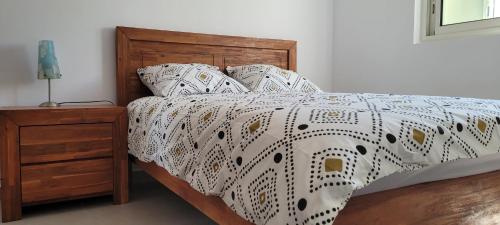 מיטה או מיטות בחדר ב-MON CHEZ MOI