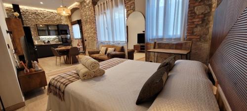 Postel nebo postele na pokoji v ubytování SUITE HAUS BAHIA