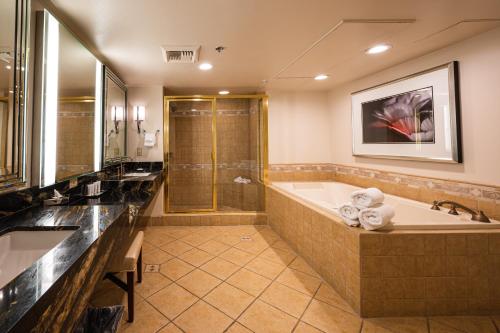 a large bathroom with a tub and a shower at Sunset Station Hotel & Casino in Las Vegas