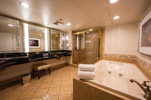 a large bathroom with a tub and a shower at Sunset Station Hotel & Casino in Las Vegas