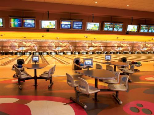a bowling alley with tables and chairs and bowling lanes at Sunset Station Hotel & Casino in Las Vegas