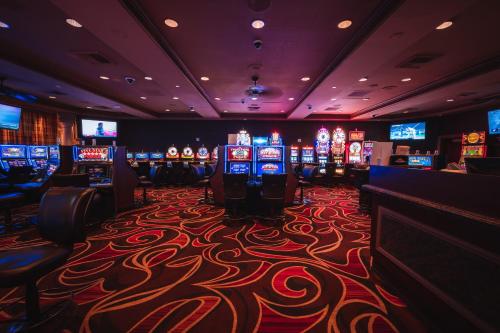 a casino with many slot machines in a room at Sunset Station Hotel & Casino in Las Vegas