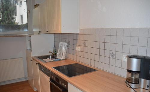 a kitchen with a sink and a counter top at *Monteurwohnung* Hagen Bahnhof in Hagen