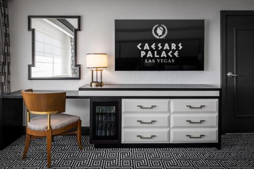 a desk with a chair and a mirror at Caesars Palace Hotel & Casino in Las Vegas