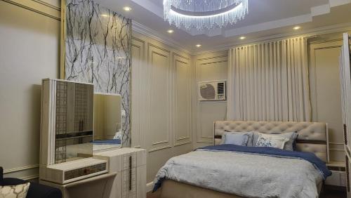 Postel nebo postele na pokoji v ubytování غرفة استديو مثالية جيزان