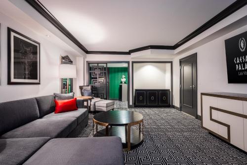 a living room with a couch and a table at Caesars Palace Hotel & Casino in Las Vegas