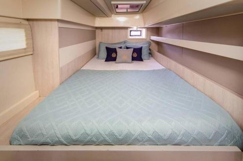 a small bed in the back of a trailer at All Inclusive Luxury Yacht with Private Island in Cancún