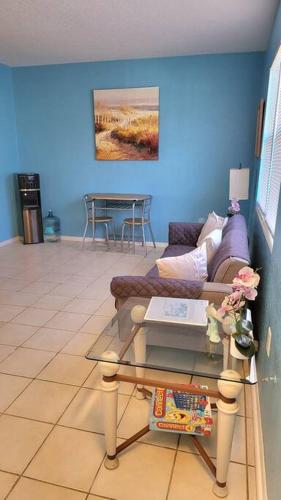 a living room with a couch and a table at Entire Home by Siesta Key/closed to downtown in Sarasota