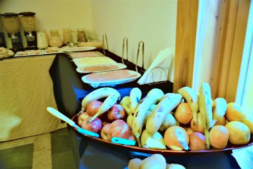 a kitchen with a table with a bowl of food at Hosteria Patagon in Villa La Angostura