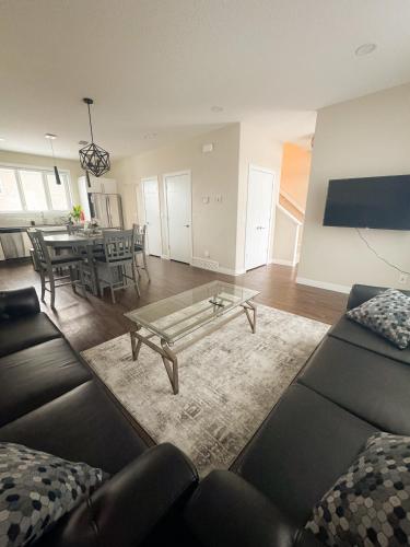 a living room with a couch and a coffee table at Entire house to yourselves - NO basement sharing in Regina