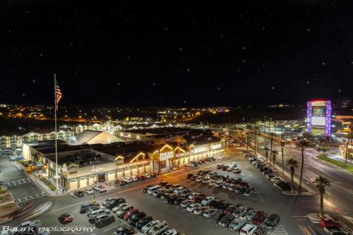 a parking lot with cars parked in front of a building at Mesquite Retreat 2 Bd Condo by Cool Properties LLC in Mesquite