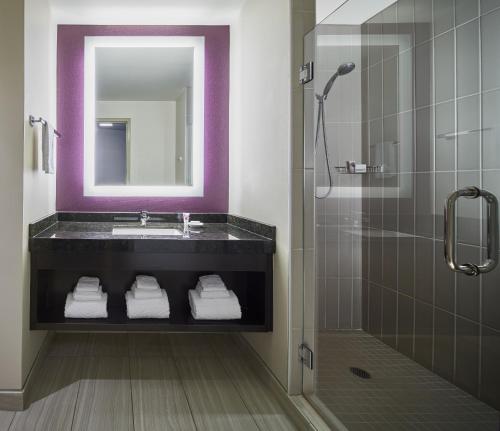 a bathroom with a sink and a mirror at Harrah's Cherokee Valley River Casino & Hotel in Murphy