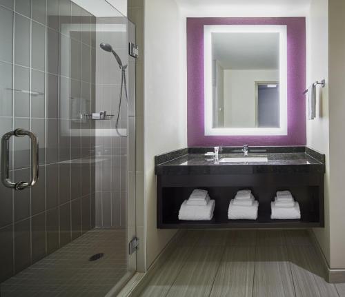 a bathroom with a sink and a mirror at Harrah's Cherokee Valley River, A Caesars Destination in Murphy