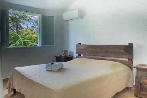 Postel nebo postele na pokoji v ubytování Les Bungalows du Moulin