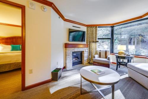 a living room with a couch and a fireplace at Breathtaking Olympic Valley Gem Walk to Chairlift in Olympic Valley