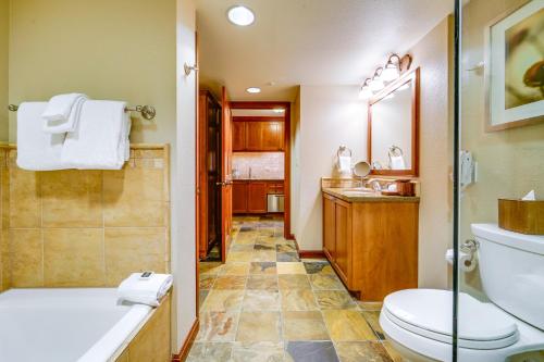 a bathroom with a toilet and a shower and a sink at Breathtaking Olympic Valley Gem Walk to Chairlift in Olympic Valley