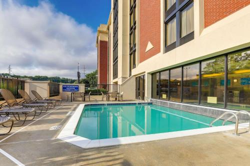 a swimming pool in front of a building at Drury Inn & Suites Atlanta Marietta in Marietta