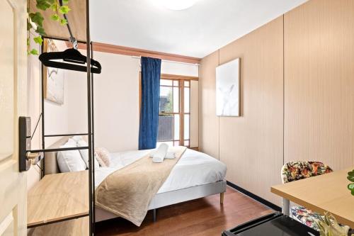 a small room with a bed and a window at Double Room in Gordon near Train & Bus Sleeps 1 in Pymble