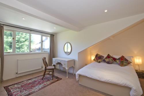 Llit o llits en una habitació de Japonica Cottage