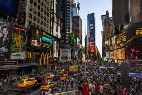 a busy city street with taxis and crowds of people at Modern one bedroom apartment in Elizabeth